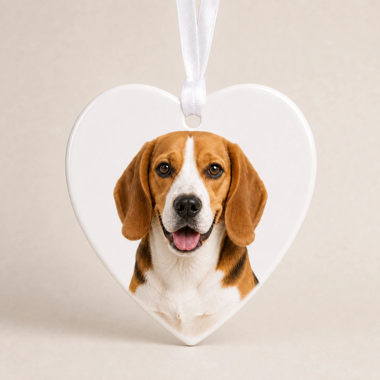 Heart-shaped personalized dog memorial ornament on a clean white background