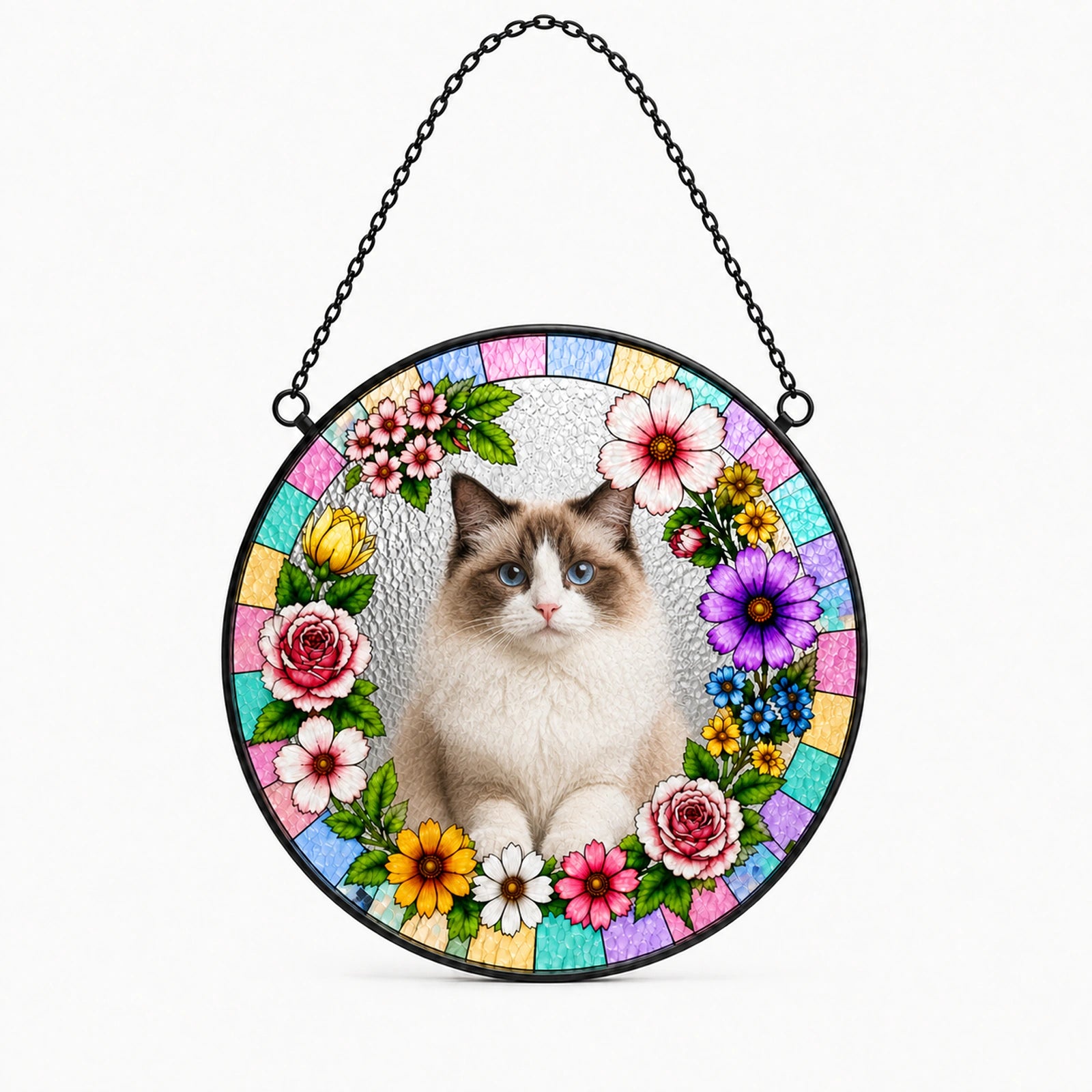 A circular hanging stained-glass-style ornament featuring a fluffy white cat in the center, surrounded by colorful flowers and pastel mosaic panels, suspended by a black chain against a light gray background.
